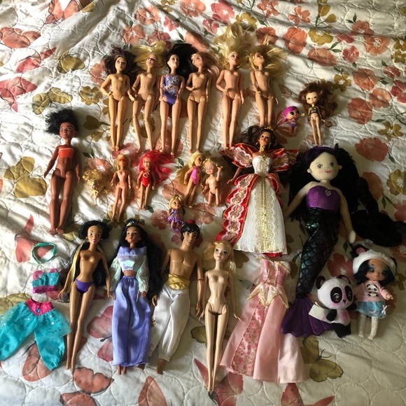 Huge assortment of disney and vintage Barbie doll/ na an surprise bundle